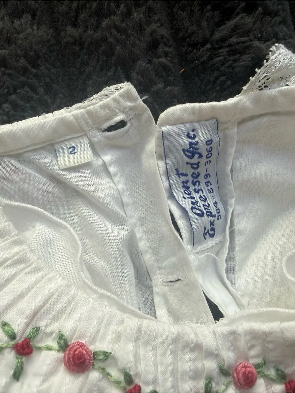 White Smocked Girls' Dress with Red Satin Sash